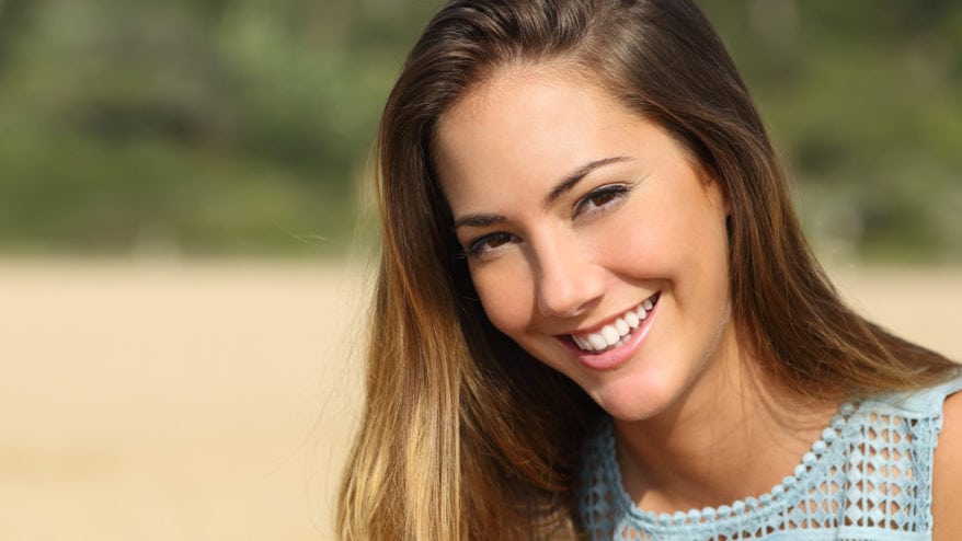 Young Woman Smiling Outside