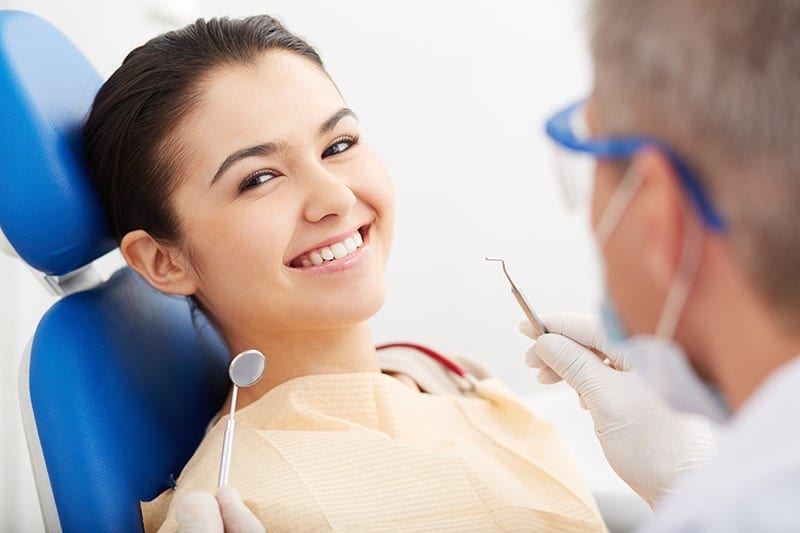 Woman in Dental Chair Smiling