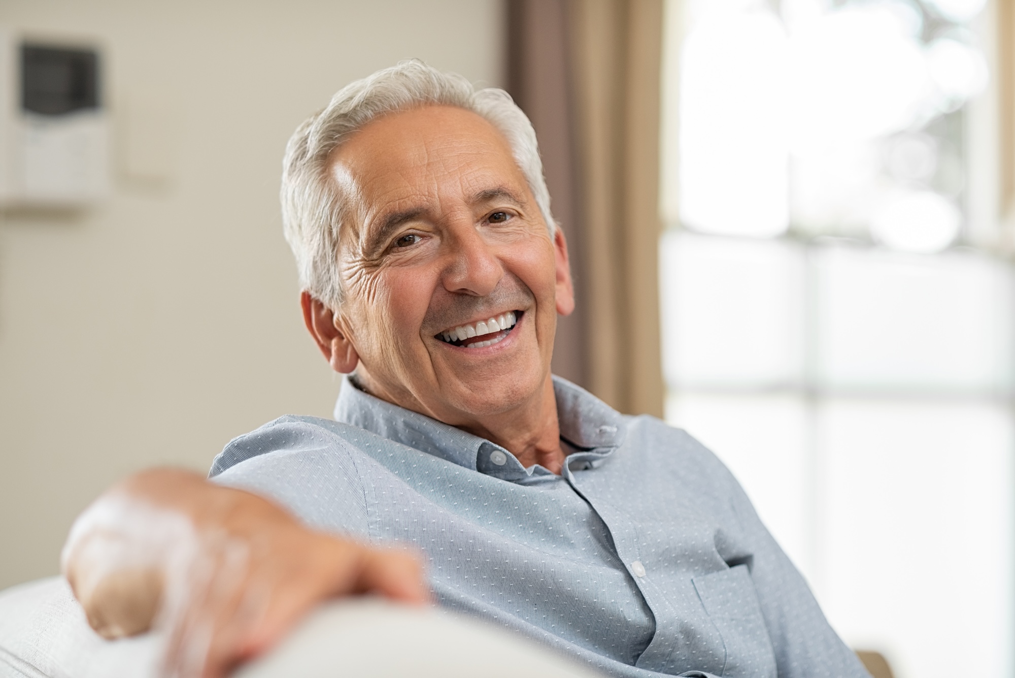 Image of a young man with white teeth thanks to teeth whitening in Albuquerque